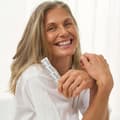 Woman holding The Solution stick pack