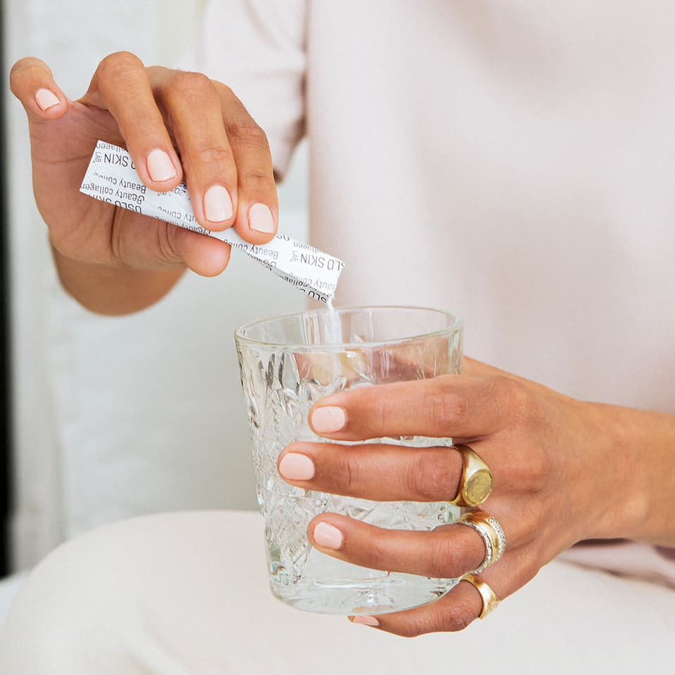 Woman pouring The Solution in glass